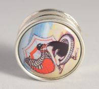 A CIRCULAR SILVER AND ENAMEL PILL BOX. 1ins diameter.