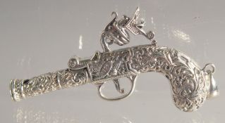 A MINIATURE SILVER GUN. 2.5ins long.
