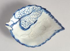 A LIVERPOOL LEAF SHAPED DISH decorated in blue on a moulded leaf, with flowers and butterfly in
