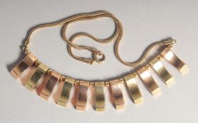 A 14CT GOLD FLEXIBLE NECKLACE.