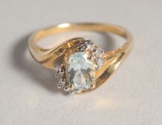 A 10CT GOLD AQUAMARINE AND DIAMOND RING.
