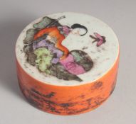 A CHINESE CIRCULAR PASTE BOX AND COVER, the top painted with a young girl. 2.5ins diameter.