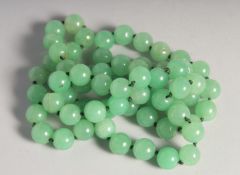 A STRING OF JADE BEADS.