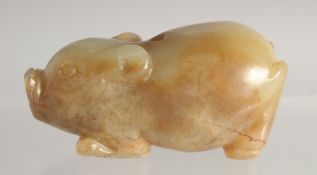 A CARVED RUSSET JADE PIG. 2.25ins long.