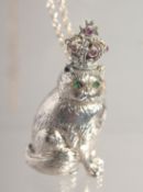 A SILVER ROYAL CAT with emerald eyes and ruby crown.