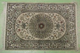 A SMALL PERSIAN RUG with central medallion. 3ft x 2ft.