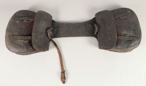 AN OLD LEATHER SADDLE BAG.