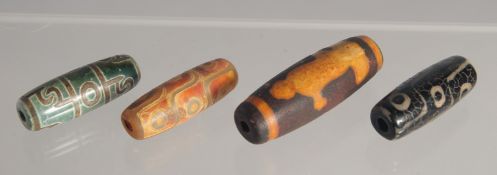 FOUR AGATE DZI BEADS
