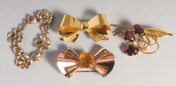 THREE SILVER GILT BROOCHES AND BRACELET.