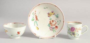 A LIVERPOOL TEABOWL, COFFEE CUP AND SAUCER with coloured floral decoration.