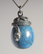 A SILVER AND LAPIS EGG PENDANT.
