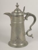 A LARGE PEWTER LIDDED JUG. 13ins high.