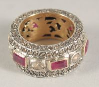 A PLATINUM RING set with various stones.