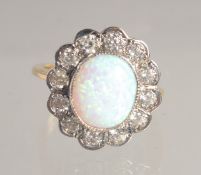 A SILVER GOLD PLATED OPAL AND C Z RING.