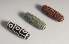 THREE AGATE DZI BEADS.