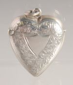 A VICTORIAN ENGRAVED SILVER HEART SHAPED VESTA. 1.25ins x 1.5ins. Birmingham 1899.