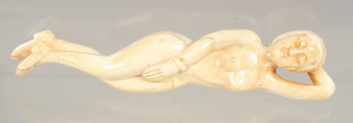A CARVED BONE DOCTOR'S FIGURE. 4.75ins long.