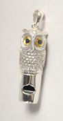 A SILVER OWL WHISTLE.