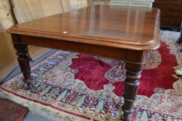 A GOOD 19TH CENTURY MAHOGANY EXTENDING DINING TABLE, with two loose leaves.