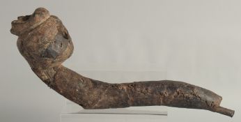A RARE EARLY WOOD AND METAL TRIBAL PIPE. 16ins long.