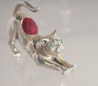 A SILVER CAT PIN CUSHION.