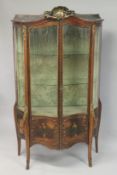 A GOOD LARGE 19TH CENTURY FRENCH LOUIS XV DESIGN SERPENTINE FRONTED VITRINE with rich ormolu mounts,
