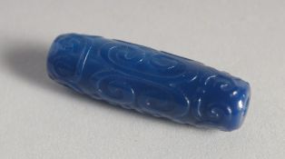 A CARVED BLUE AGATE DZI BEAD.