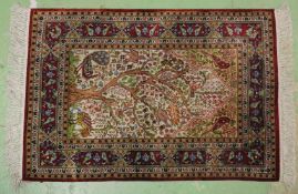 A SMALL PERSIAN TREE OF LIFE RUG 2ft 11ins x 2ft 1in.