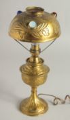 AN ART DECO GILT METAL LAMP set with three coloured stones. 12.5ins high.