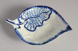 A LIVERPOOL LEAF SHAPED DISH decorated in blue on a moulded leaf with moulded flowers and