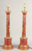 A PAIR OF TOLEWARE LAMPS with Chinese design. 24ins high with electric fittings.