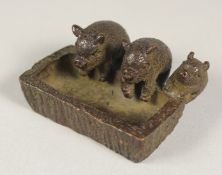 A JAPANESE BRONZE GROUP OF THREE PIGS. 1.75ins