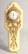 A SMALL FRENCH WALL CLOCK with good ornate mounts. 5ins long.