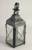AN OLD BLACK PAINTED TIN LANTERN. 13ins high.