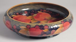 WILLIAM MOORCROFT CIRCULAR POMEGRANATE CIRCULAR BOWL. circa. 1925. W. M. script in blue,