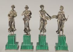 A SUPERB SET OF FOUR SILVER CLASSICAL FIGURES ON MALACHITE BASES. Mark: head 84, Faberge mark. 7.