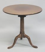 A GEORGE III MAHOGANY CIRCULAR TOP TRIPOD TABLE with bird cage support. 68cm diameter, 69cm high.