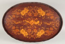 A GOOD EDWARDIAN MAHOGANY INLAID OVAL TEA TRAY with floral garlands and ribbon motifs.