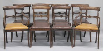 A SET OF EIGHT LATE REGENCY MAHOGANY DINING CHAIRS, two with arms, all with panelled cresting rails,
