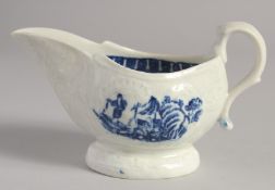 A LIVERPOOL SAUCEBOAT moulded and printed in blue with two landscapes in moulded panels.