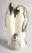 A MOORCROFT PORCELAIN GROUP OF TWO PENGUINS AND CHICK. Dated, 2009. 6.5ins high.