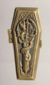 A BRASS COFFIN WITH SKELETON VESTA.