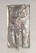 A SILVER RUBY AND DIAMOND SET CAT VESTA.