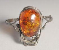 A SILVER AND AMBER BANGLE.
