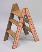 A PAIR OF NOVELTY PINE CHAMPAGNE STEPS. 34ins high.