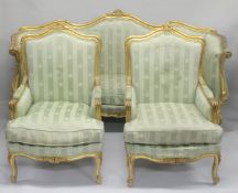 A FRENCH STYLE GILTWOOD THREE PIECE SUITE, comprising three seater settee and a pair of matching