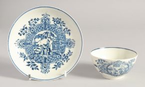 A LIVERPOOL TEABOWL AND SAUCER printed in blue with a mother child and man fishing, after