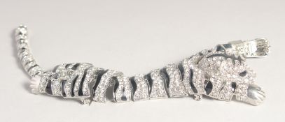 A LARGE DIAMONTE TIGER BROOCH. 9ins long.