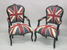 A PAIR OF EBONISED OPEN ARMCHAIRS upholstered with a Union Jack flag fabric.