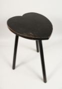 A WOODEN STOOL with heart shaped top. 21.5